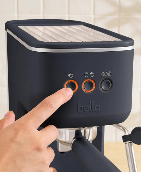 Hand pressing button on 20 Bar Slim Espresso Maker With 1300 Watt Pump And 360 Degree Steam Wand For Silky Microfoam.