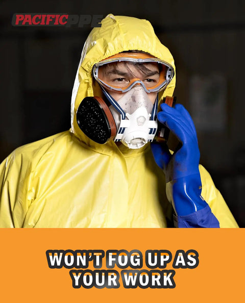 Person wearing safety gear, including respiratory mask and goggles, for industrial protection