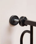 Close-up of black Extra Wide Baby Gate 29 To 49 Inches For Doorways And Stairs, Pressure Mounted Safety Gate With Door part.