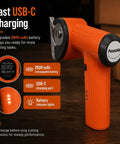 Cordless Electric Cardboard Cutter 3/8 Inch Blade For Thick Shipping Boxes And Cartons shows ergonomic orange handle with USB-C charging and battery indicators.