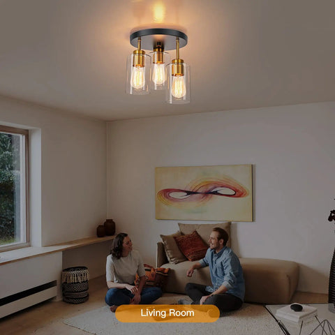 Black And Gold Semi Flush Mount Ceiling Light Three Light Fixture With Clear Glass Shades in modern living room setting