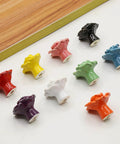 Assorted colorful ceramic rose knobs, including the Cute Ceramic Rose Knob Set Yellow Vintage Kitchen Style Drawer Pulls 6 Pack Rose Flower Cabinet Knobs With 3 Size Screws For Dresser Cupboard Wardrobe Girls Room Decor displayed on a white surface.