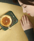 Smart Home Cup Warmer Heating Plate With Smart Temp Control Keeps Your Daily Sips Locked And Toasty Auto Shutoff Safety Feature 25 Watt Energy Savers Green Coaster Drink Heater For Coffee And Milk Tea on a desk with a glass mug.