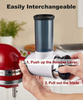 Hands changing blades on an Effortless Slicer Shredder Attachment For Your Stand Mixer Lets You Slice Grate And Process Food Like A Boss