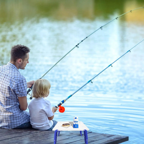Father and child fishing with Grab-And-Go Portable Folding Beach Table For Sand with snacks on dock