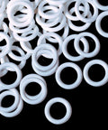 One Hundred Piece Bulk Stash Of Crisp Clear Plastic Roman Blind Curtain Rings crafted for quick DIY home decor updates, close-up of white O-rings.