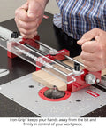 Zero Drama Small Parts Holder For Router Tables Delivers Big Time Accuracy And Rock Solid Safety For Your Shop With Heavy Duty Clamps And Precision Stop Pins For Tenons Rabbets And Dados in use with a router table and wooden workpiece.