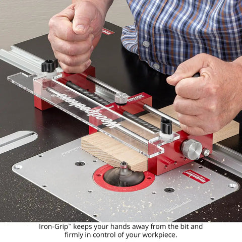 Zero Drama Small Parts Holder For Router Tables Delivers Big Time Accuracy And Rock Solid Safety For Your Shop With Heavy Duty Clamps And Precision Stop Pins For Tenons Rabbets And Dados in use with a router table and wooden workpiece.