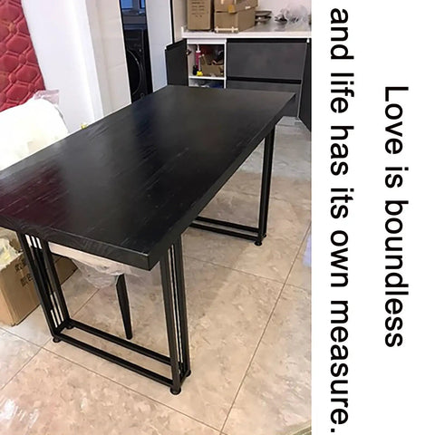 Adjustable Steel Desk Legs Set Of Two supporting a black table, heavy duty iron construction for DIY furniture upgrades.