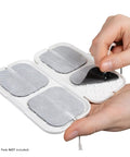 This Heavy Duty Tens Pad Holder Keeps Replacement Electrode Pads Tidy And Safe. A hand opening the case with two 2x2 therapy pads visible.