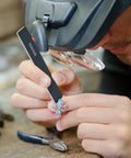 Person using a stick from 40 Pcs Polishing And Sanding Sticks For Metal Wood Plastic Models Buffing Kit on a small object