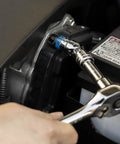 Using the Three Eighths Inch Drive Ratchet and Socket Set, 53 Piece, to adjust a car battery terminal bolt