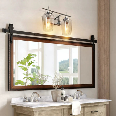 Bathroom with Two Light Chrome Vanity Light Fixtures With Clear Glass Shade For Over Mirror Bathroom Lighting next to plants.
