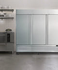 Rock Solid Commercial Workhorse Upright Freezer And Convertible Refrigerator With 72 Cubic Feet Capacity Frost Free Design Slick Stainless Steel Exterior in a kitchen setting.