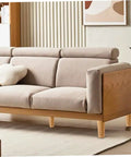 Beige sofa with 4 Piece Beefy Heavy Duty Load Bearing Round Cylinder Wooden Cabinet Legs Set for added support