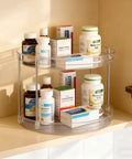 Two Pack Two Tier Clear Acrylic Lazy Susan Turntable Organizer with medicine bottles in cabinet, smooth rotating design.