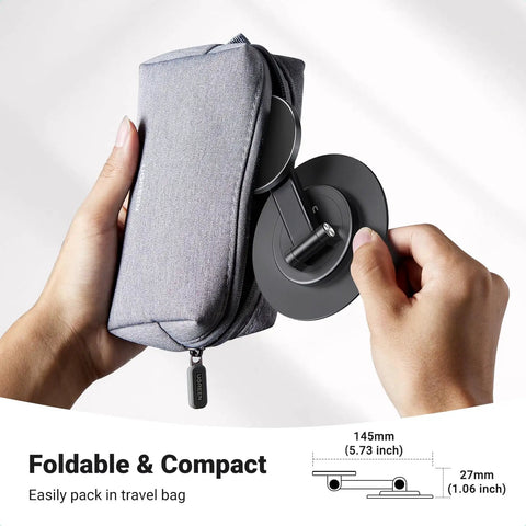 Magnetic MagSafe Phone Stand For Desk, Height Adjustable And 360 Degree Rotation, shown folded and held next to a gray travel pouch