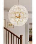 Top Tier 30 Inch 12 Light Pendant Featuring Solid Brass And Fresh White Swirl Handmade Glass For Covered Patios And Chill Living Areas Damp Rated Slick Lamp Design With No Bulbs, hanging in a modern interior setting.