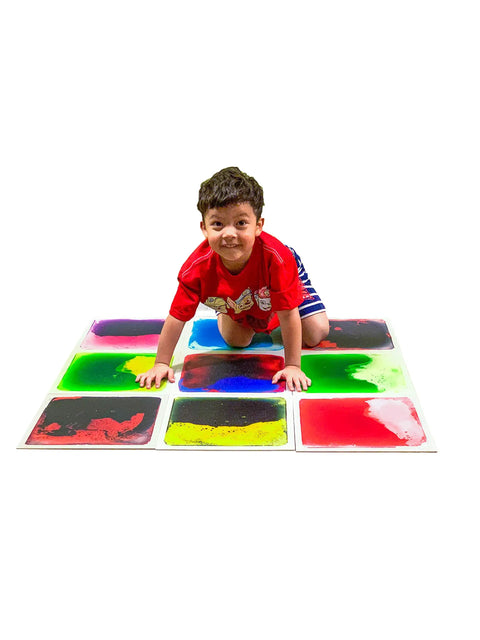 Child playing on Liquid Sensory Floor Tiles 15.8 Inch Square 4 Pack Colorful Fun Non-Toxic Liquid Moves With Every Step Anti Slip Backing