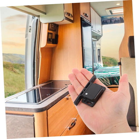 Person holding RV Compartment Latch Kit 4 Pack Durable Trailer Locks for Cabinet Doors with stainless screws inside RV interior.