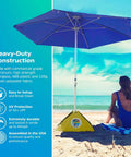 All-In-One Beach Umbrella System With Ultra Base Deep Ocean Blue Seven Point Five Foot Canopy on sandy beach near ocean