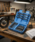 Beast Mode 12 Piece Bearing Extraction Device Internal Puller Tool Kit With Remover Rods Sleeves Adapters Made From 45 Steel Heavy Duty Darkened Finish For Serious Garage Mechanics And DIY Auto Repair open case on workbench