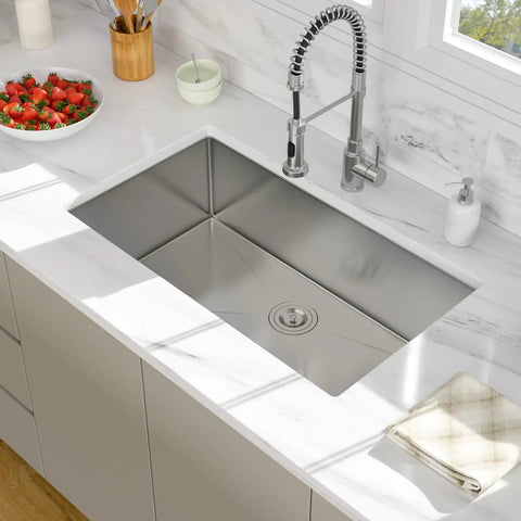 14 Inch Undermount Bar Sink For Kitchen And RV Use, 18 Inch Wide By 9 Inch Deep Single Bowl, 16 Gauge Stainless Steel Small Bar Prep Sink, Durable TRU16 T304 Construction That Resists Corrosion And Dents installed in a modern kitchen countertop.