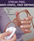 Front view: brown-frame glasses being wiped with a white cloth, showing OptiSource Clear View lens cleaner.