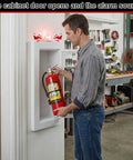 Man accessing Recessed 10 Pound Fire Extinguisher Cabinet With Alarm, White Steel Wall Mount Safety Box in workshop