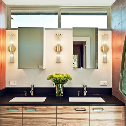 Mid Century Brass Glass Rod Wall Sconces With Two Lights Vanity Light Fixtures in modern bathroom with mirrors and sinks.