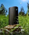 Take Anywhere Portable Bluetooth Speaker With WiFi Alexa Built In 24 Hour Battery Life Wireless Charging Base on a rock outdoors