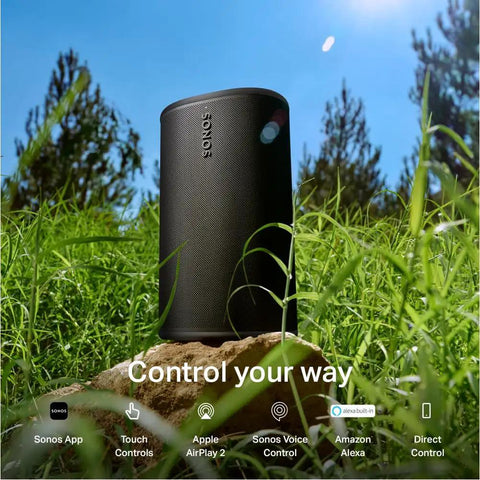 Take Anywhere Portable Bluetooth Speaker With WiFi Alexa Built In 24 Hour Battery Life Wireless Charging Base on a rock outdoors