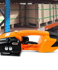 Slick Hand Held Electric Strapping Machine For Pp And Pet. Portable Automatic Packaging Sealer with rechargeable battery, orange and black design.
