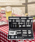 28 Piece Kickass BBQ Tool Set With Thermometer In Heavy Duty Stainless Steel Case displayed on outdoor table