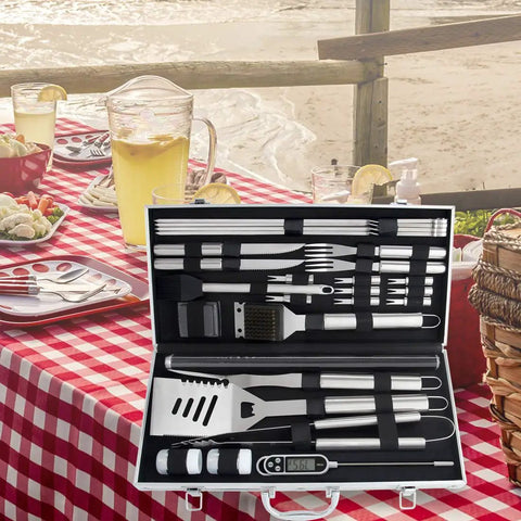 28 Piece Kickass BBQ Tool Set With Thermometer In Heavy Duty Stainless Steel Case displayed on outdoor table