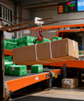 Heavy Duty Forklift Lifting Hook Attachment Single Fork Mount lifting a box with a 360 swivel and 4400 pound capacity in a warehouse.