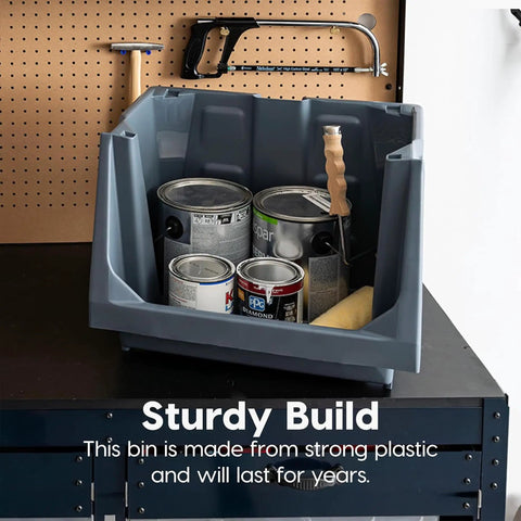 Six Pack Dark Gray Open Front Storage Totes With Oversized Handles Built Like A Tank Heavy Duty Stackable Plastic Bins Mega Capacity For Garage Gear And Home Drop Zones Shed Interlocking Top Shelf Design filled with paint cans on a work surface.