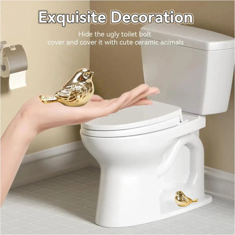 Upgrade Your Bath Setup With These Fresh Golden Bird Ceramic Toilet Bolt Caps next to a white toilet, showcasing decorative bird design.