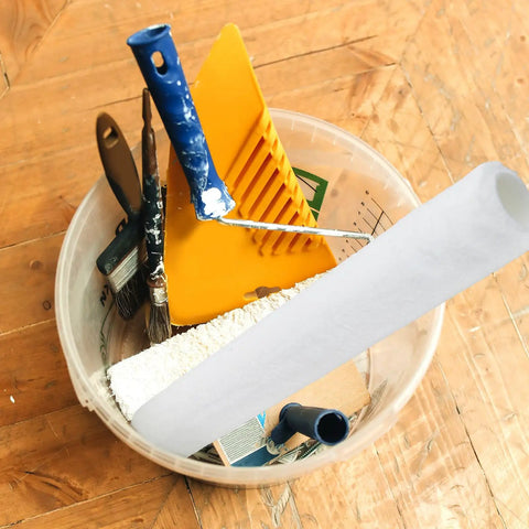 Dead-On Replacement Paint Roller Sleeve Cover With Heavy Duty Plastic Frame And Silky Glide Finish For Smooth Coat Coverage And Fast Room Refreshes Done Right in a bucket with paint tools.