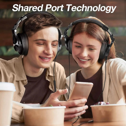 Two people wearing Dual Mode Bluetooth Over Ear Headphones With 72 Hour Battery Life, listening together via shared port technology.