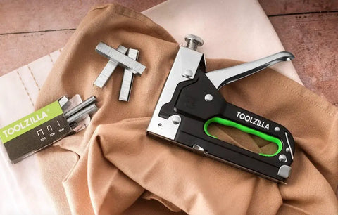 Heavy Duty Staple Gun Kit With Staples Pack For Fabric, Cable, And Wood Projects on fabric surface
