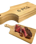 Front view of 6-piece wooden mini charcuterie boards, 11x5 in, with handles.