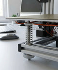 Close-up of Two Pack 0.8mm Wire Compression Springs, 10mm Outer Diameter, 300mm Long, Steel Pen Springs holding a 3D printer bed.