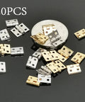20 Pack Mini Cabinet Door Hinges For Dollhouses And Small Wooden Boxes, assorted silver and gold hardware set on black background.