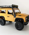 Side view of One Twelfth RC Crawler MN98 Remote Control Truck Off Road Four By Four Land Rover Defender Style in yellow