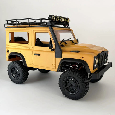 Side view of One Twelfth RC Crawler MN98 Remote Control Truck Off Road Four By Four Land Rover Defender Style in yellow