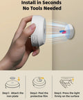Hand holding 4 Pack Motion Sensor Closet Lights USB C Rechargeable Puck Lights with magnetic stick on feature for easy installation.