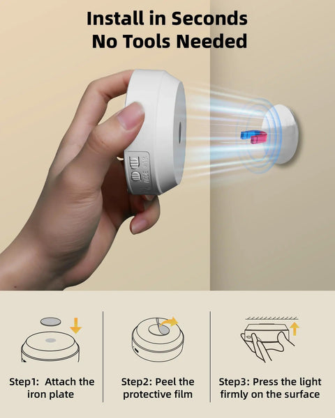 Hand holding 4 Pack Motion Sensor Closet Lights USB C Rechargeable Puck Lights with magnetic stick on feature for easy installation.