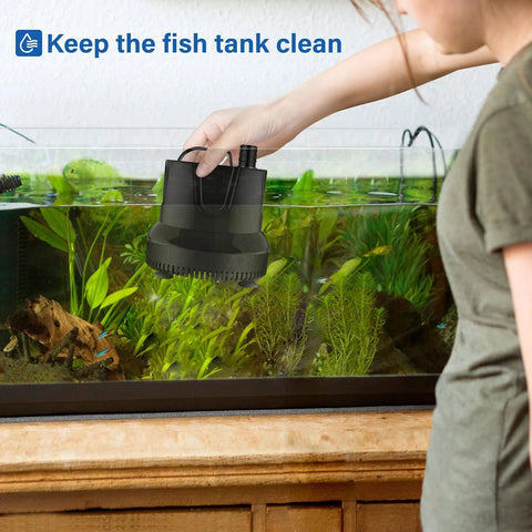 Simple Deluxe 800GPH bottom-suction submersible pump, black, held over a glass fish tank with plants.