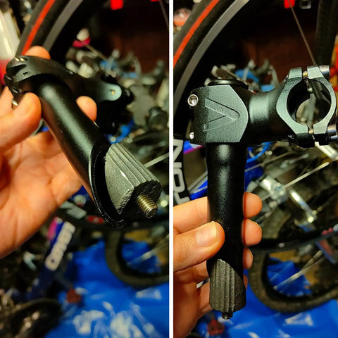Hands holding black riser quill stem adapter for 22.2mm, 25.4mm, 28.6mm forks; 150mm aluminum MTB road bike handlebar extender.